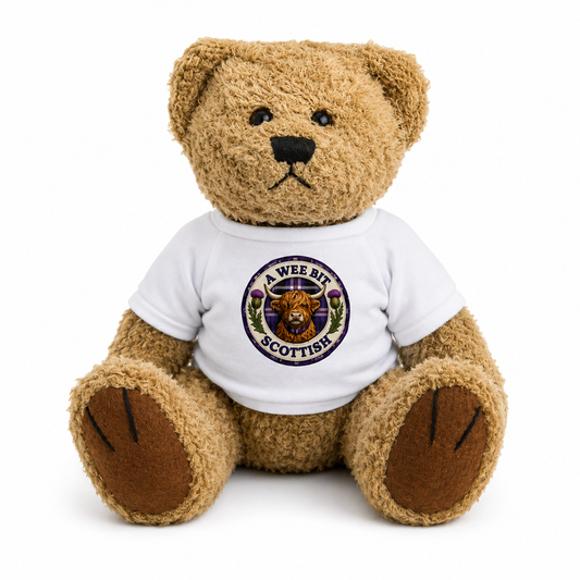 A Wee Bit Scottish Teddy Bear wearing a white t-shirt with Highland Cow badge design on a white background