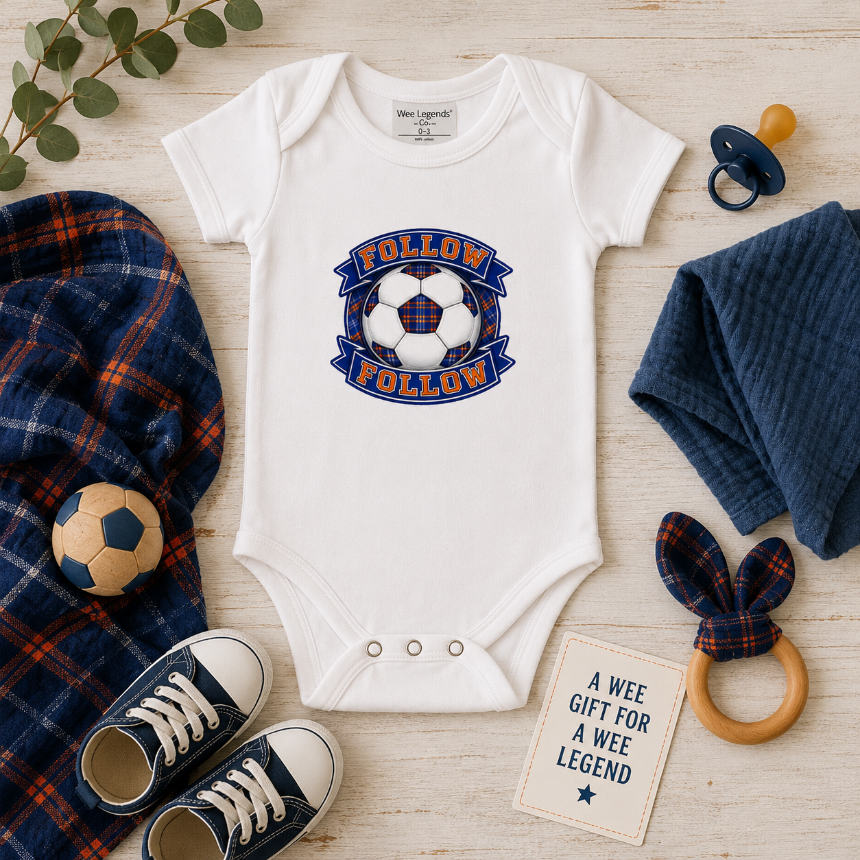 FOLLOW FOLLOW baby bodysuit displayed with baby accessories