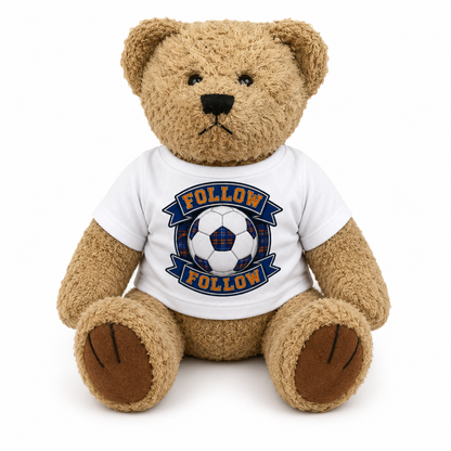 FOLLOW FOLLOW teddy bear wearing a white t-shirt with football crest design on a clean white background.
