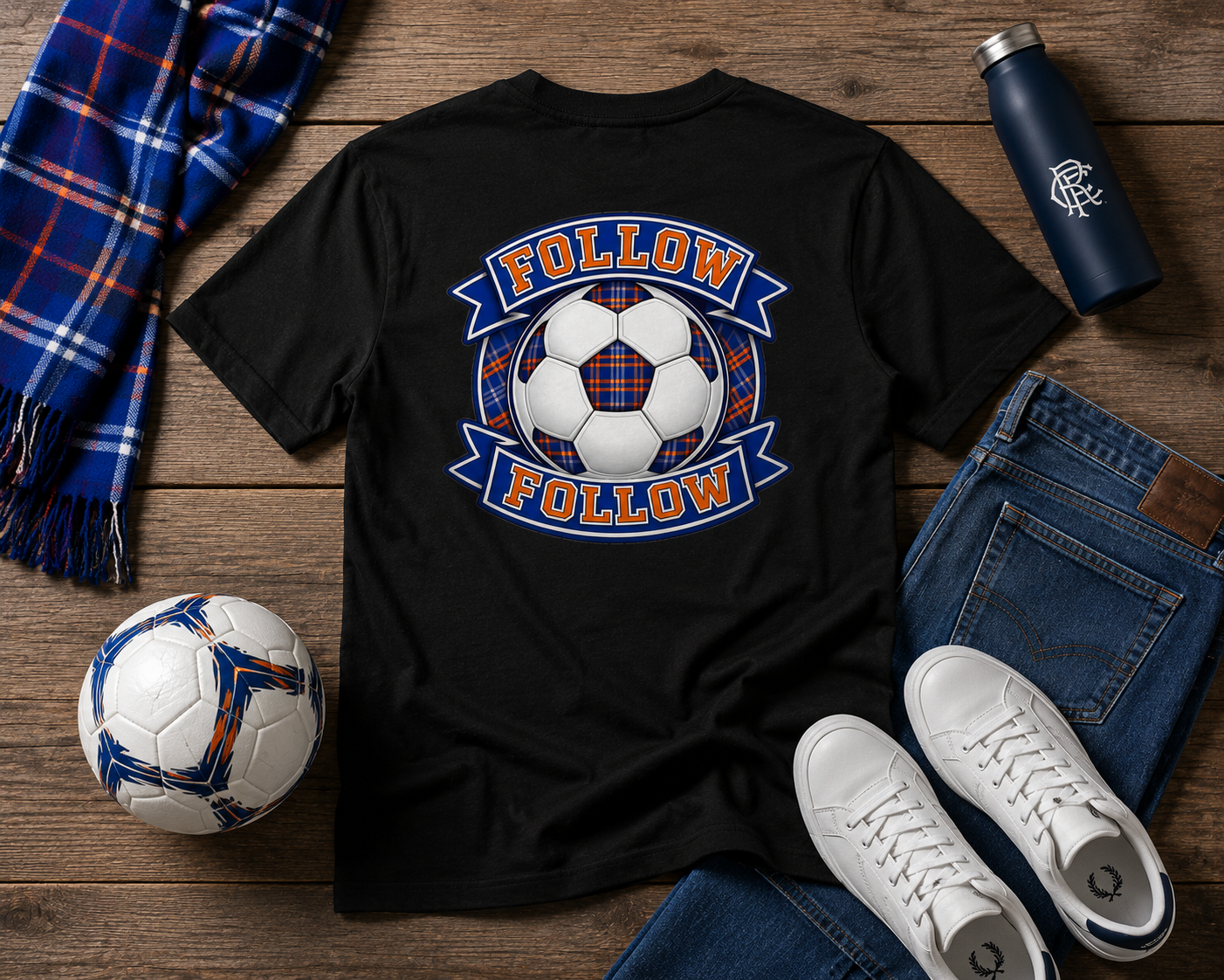 FOLLOW FOLLOW men's t-shirt displayed in a football-themed flat lay with a tartan scarf, football, jeans and white trainers.