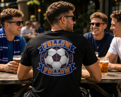 Man wearing a black FOLLOW FOLLOW men's t-shirt with a large football-inspired back print while relaxing with friends in an outdoor pub garden.