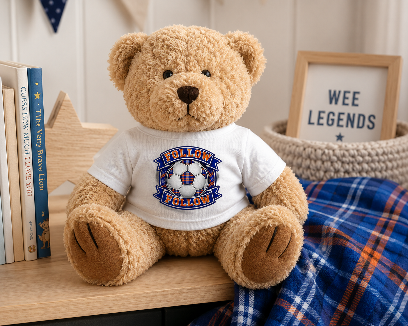 "FOLLOW FOLLOW teddy bear sitting on a nursery shelf wearing a white t-shirt featuring the FOLLOW FOLLOW football-inspired design."