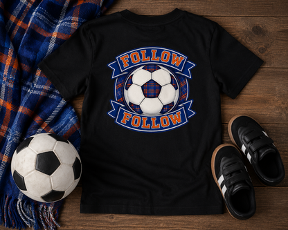 FOLLOW FOLLOW youth t-shirt displayed in a flat lay arrangement with football-inspired accessories and tartan details.