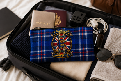 Blue tartan Scottish pencil case featuring the ‘If You Cannae Dae The Bouncy You’re A Tim’ football-inspired design, packed inside a suitcase with travel essentials. Perfect as a travel organiser for pens, cables, toiletries and everyday accessories.