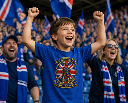 Young football fan celebrating on match day while wearing a royal blue If You Cannae Dae The Bouncy youth t-shirt featuring a Union Flag-inspired supporter crest.
