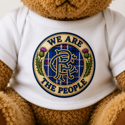Close-up of the We Are The People Crest design printed on the teddy bear's white t-shirt.