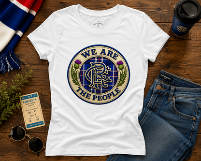 Flat lay of the We Are The People women's fitted t-shirt displaying the Scottish crest design with tartan pattern and thistle details.