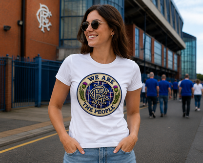 Women's fitted white t-shirt featuring the We Are The People crest design with Scottish thistles, tartan background and blue crest artwork.
