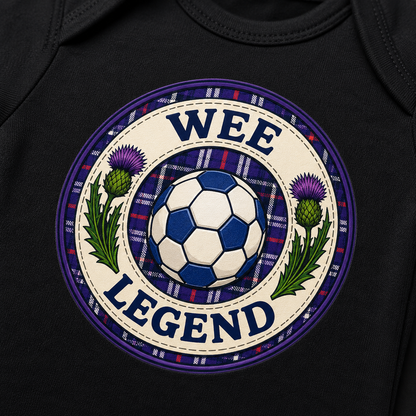 Close-up of the Wee Legend football badge featuring Scottish thistles, tartan pattern and blue football.