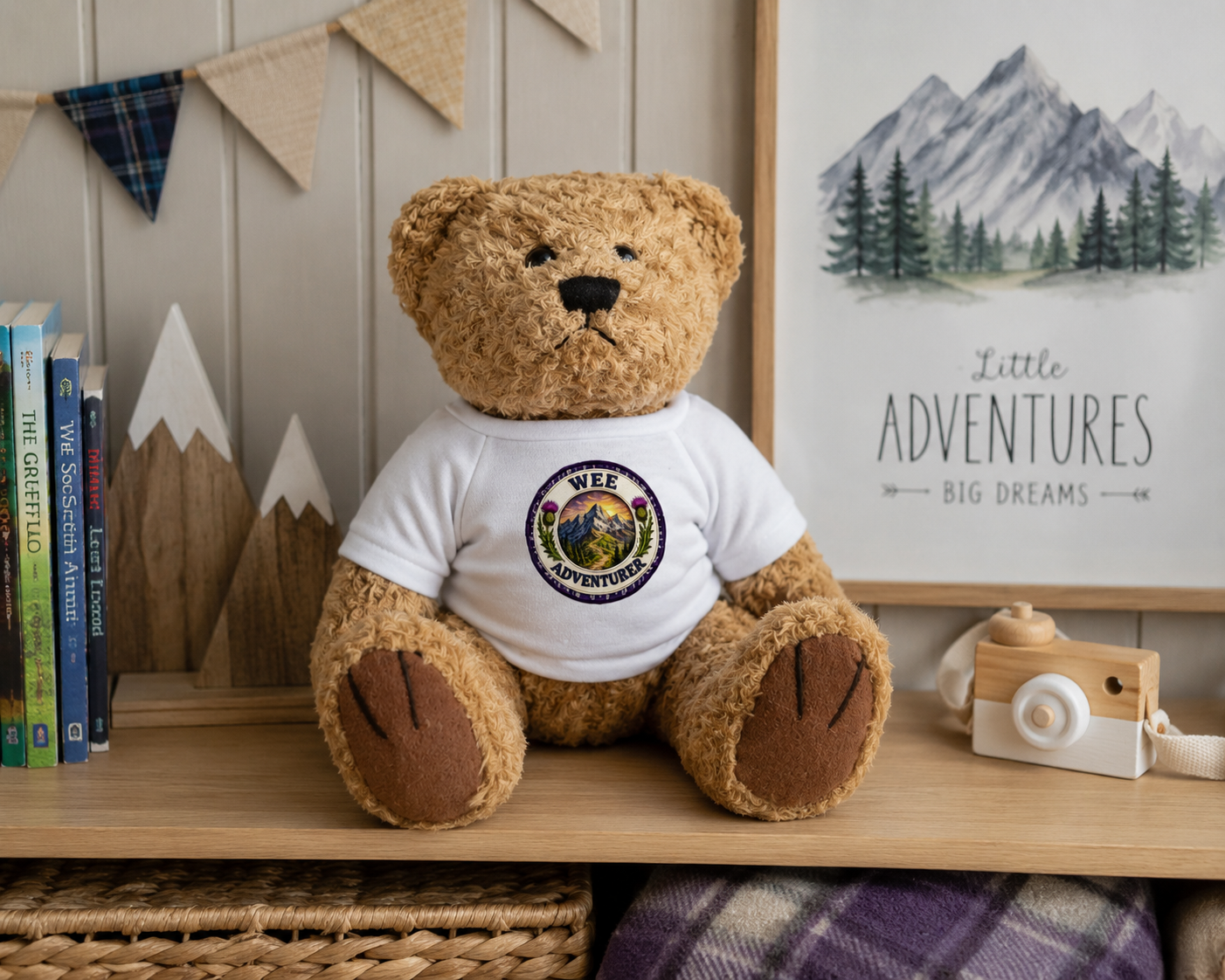 Wee Adventurer Teddy Bear displayed in a cosy adventure-themed nursery with mountain décor and children's books