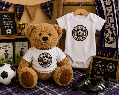 Wee Legend Teddy Bear beside a matching Wee Legend baby bodysuit gift set