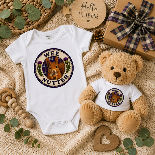 Wee Nutter baby gift set displayed on a cosy knitted blanket with matching bodysuit, teddy bear, gift box and Scottish tartan ribbon.