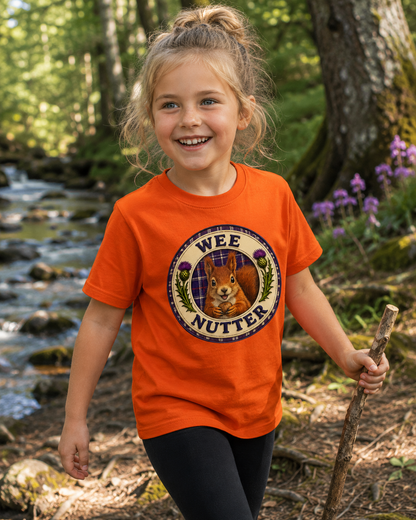 Young explorer wearing the Wee Nutter youth t-shirt in a Scottish countryside setting.