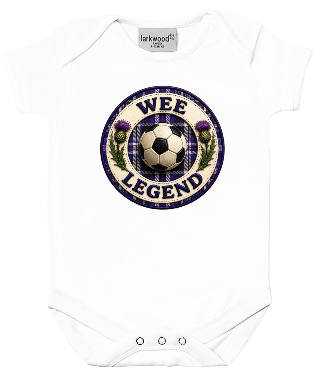 White baby bodysuit featuring the Wee Legend football badge design with tartan detailing on a clean product mockup.