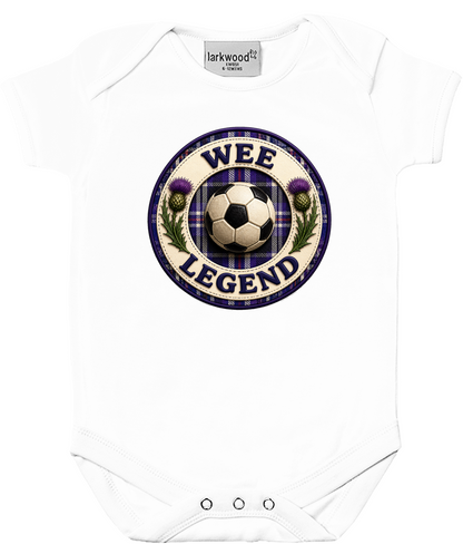 White baby bodysuit featuring the Wee Legend football badge design with tartan detailing on a clean product mockup.